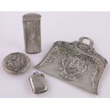 An ornate Dutch embossed silver crumb scoop, continental silver vesta case,