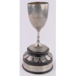 An unmarked Indian white metal trophy, dated 1931, inscribed under base "Handford & Crew, Calcutta,