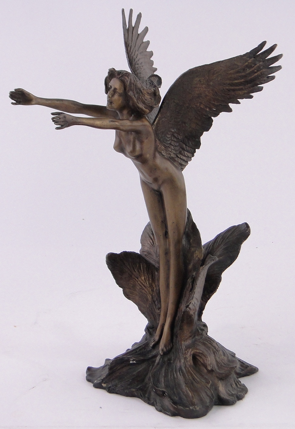 A reproduction bronze figure of a naked angel, height 35cm.