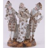 A continental porcelain group, 3 dancing figures, indistinct marks under base, overall height 38cm.