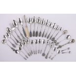 A collection of Victorian and later teaspoons, souvenir spoons, ivory handled butter knife, etc.