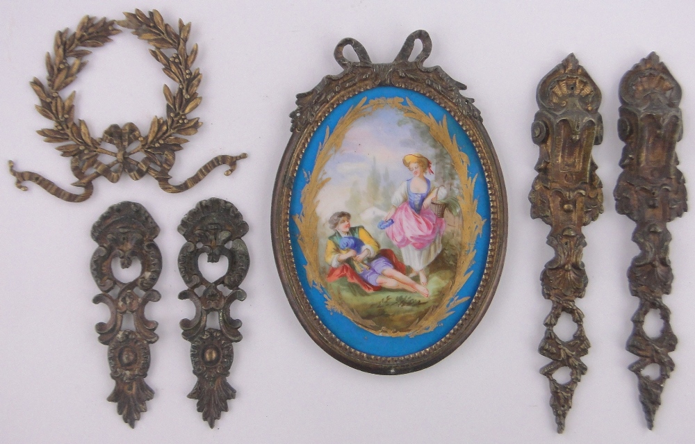 A 19th century French painted porcelain plaque in ribbon ormolu frame, overall height 19.