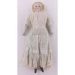 19th century French Bisque porcelain headed doll, with porcelain limbs and cloth body, height 44cm.