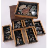 A collection of geological specimens, in stained wood 7-drawer cabinet, width 31cm.