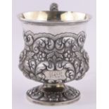 A William IV silver thistle shaped Christening mug, relief chased and embossed floral designs,