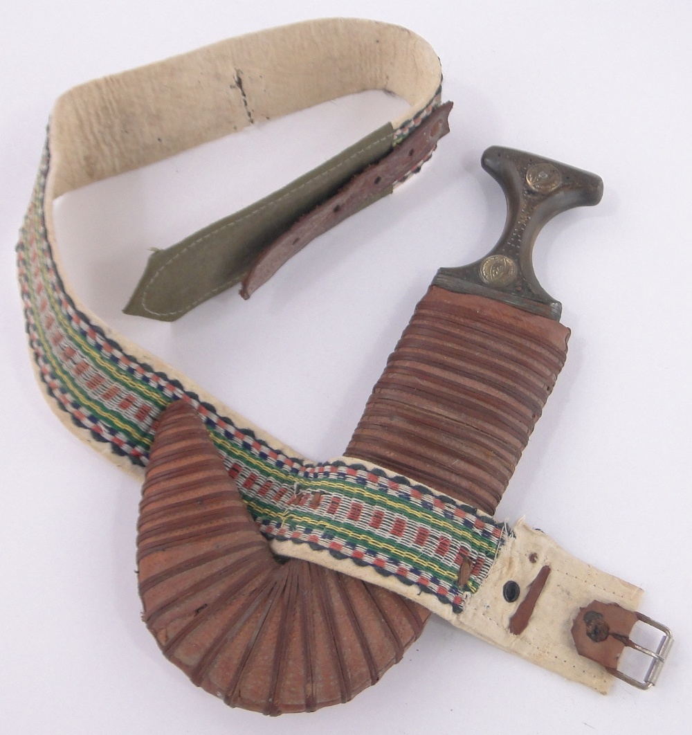 A Middle Eastern curved dagger, 18th/19th century, rhino horn handle with inlaid decoration,