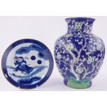 A large Chinese blue, white and green glazed prunus decorated vase,