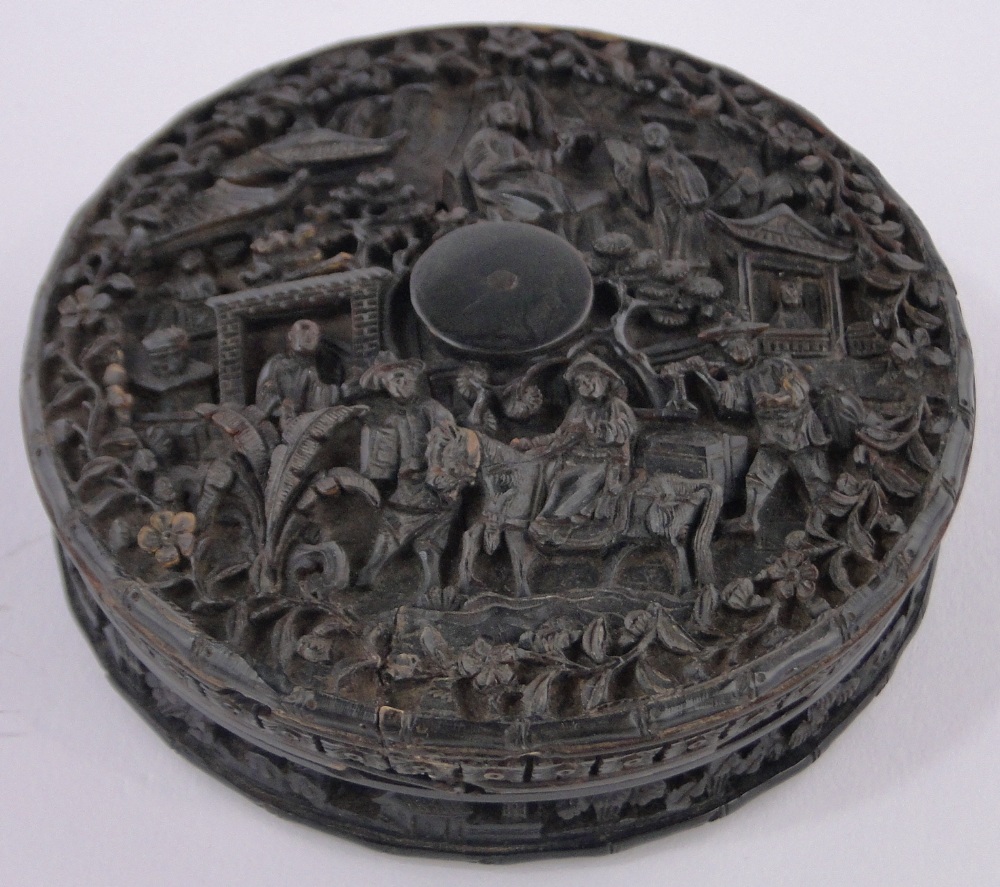 A 19th century Chinese relief carved tortoiseshell circular snuff box, diameter 9.5cm, a/f.