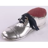 An Edwardian silver Oxford Brogue shoe design pin cushion, Birmingham 1910, length 12cm.