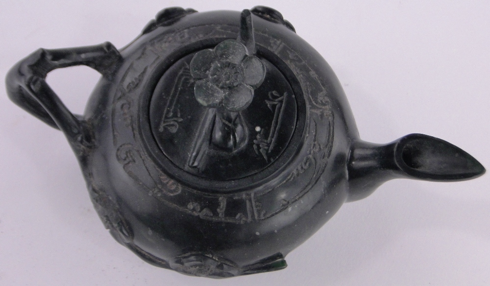 An Oriental relief carved black stone teapot, with carved floral knop, length 17cm. - Image 2 of 3