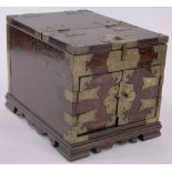 A Chinese brass bound elm box, engraved mounts and bracket feet, width 24cm, height 25cm.