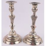 Pair of French 18th century silver plate on copper candlesticks, height 25cm.