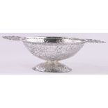 An ornate 19th century continental oval silver bowl, cast pierced classical handles,