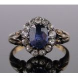 An 18ct gold sapphire and diamond cluster ring, unmarked gold settings, setting height 10mm, size G.
