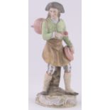 19th century German porcelain figure of a man carrying a cooking pot, height 27cm.