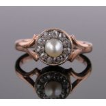 A 9ct gold diamond and pearl cluster ring, panel height 10mm, size O.