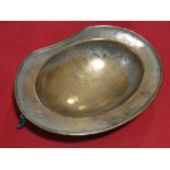 An Ottoman brass barber's bowl, engraved text inscription, width 18cm.