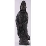 A Chinese carved and stained wood figure of Guanyin, height 60cm.