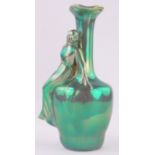 A Zsolnay green lustre vase surmounted by a classical female figure, height 23cm.