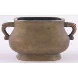 A Chinese bronze 2-handled censer, of bulbous rectangular form, impressed seal mark under,