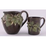 A Rye Pottery Hop Ware jug, height 16cm, rim restored and a Hop Ware pint mug, handle restored, (2).