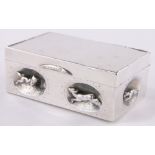 A continental silver box, oval panels to the sides with inset cast running animals,