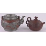 A Chinese ceramic Redware teapot with pewter mounts, and a smaller Redware teapot with incised text,