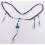 A long string of Chinese turquoise and crystal court beads.