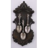 A set of 3 Antique Dutch cast silver spoons, figure decorated handles with continental hallmarks,