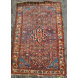 A small red ground Hamadan rug, 4' x 2'6".