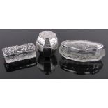 2 Cut-glass toilet jars with silver tops, and a small Oriental design plated caddy, height 5cm, (3).