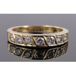 An 18ct gold 7 stone diamond half hoop ring, total diamond content approx. 0.9cts, size P.