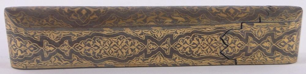 An ornate Turkish gold inlaid metal pen box, with domed top and inlaid geometric designs, length 26.