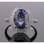 A 14ct white gold tanzanite and diamond cluster ring, tanzanite approx. 3.