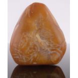 A Chinese yellow jade boulder, with relief carved figures and buildings, height 5.5cm.