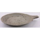 A large tribal soapstone platter with single handle, diameter excluding handle 55cm.