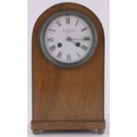 An Edwardian walnut cased domed top mantel clock, retailed by Charles Frodsham of New Bond Street,