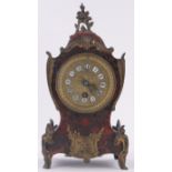 A 19th century tortoiseshell and brass boulle marquetry balloon cased mantel clock,