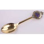 A Danish silver gilt and coloured enamel souvenir spoon.