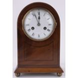 An Edwardian mahogany domed top mantel clock, enamelled dial and 8-day striking movement,