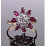 A 9ct gold ruby and diamond cluster ring, setting height 15mm, size P.