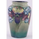 A Moorcroft "Orchid" pattern vase, impressed marks with painted WM monogram, height 15cm,