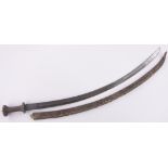 An Ethiopian curved sword, 18th/19th century, the blade having embossed portrait and text,