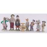 A group of English and continental porcelain, including German porcelain monkey band figure,