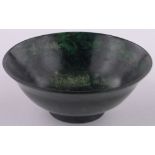 A Chinese green hardstone bowl, diameter 12.5cm, height 4.5cm.