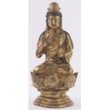 A Chinese gilt bronze seated figure of Guanyin, seated in a lotus flower, unsigned, height 18cm.