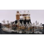 A collection of Victorian glass chemist's jars with gilded labels, (25).