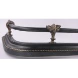 A Victorian brass and cast-iron fender, with cast acanthus scroll mounts, overall width 1.