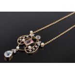 A delicate Edwardian aquamarine, tourmaline, diamond and pearl set open work pendant and chain,