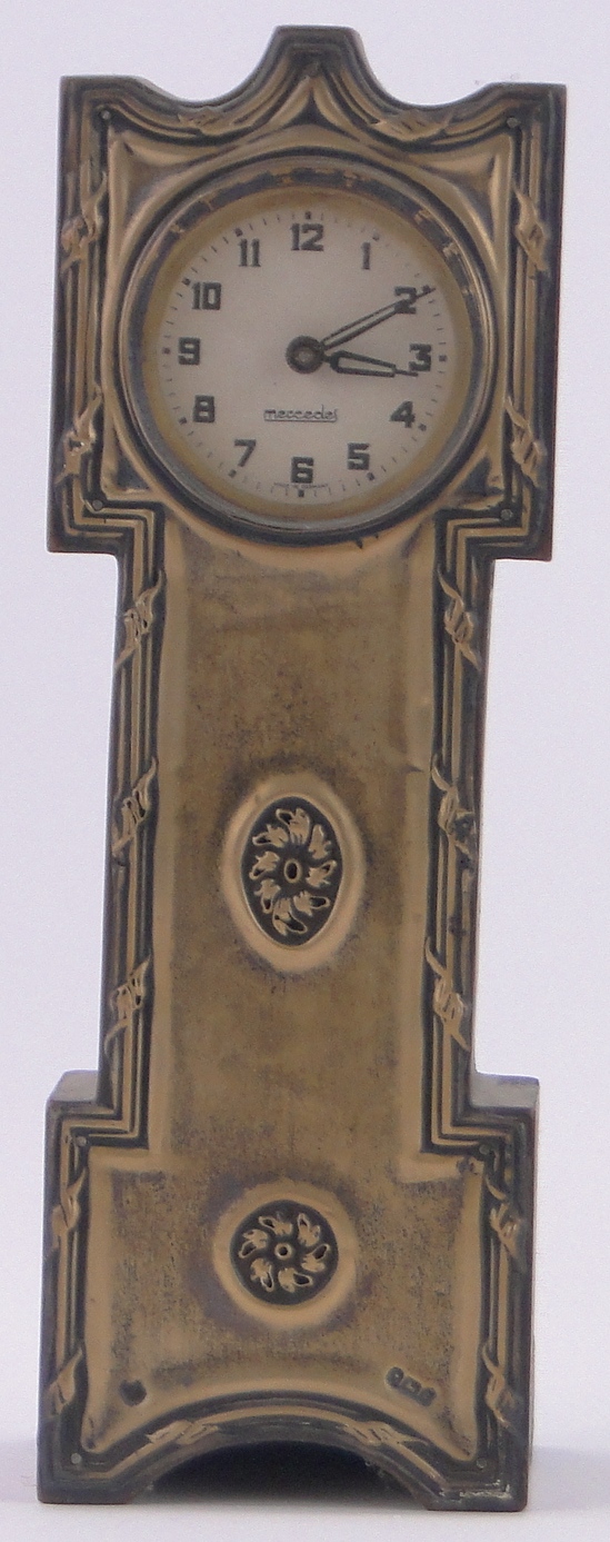 An Edwardian embossed silver fronted miniature long case clock, dial signed Mercedes,
